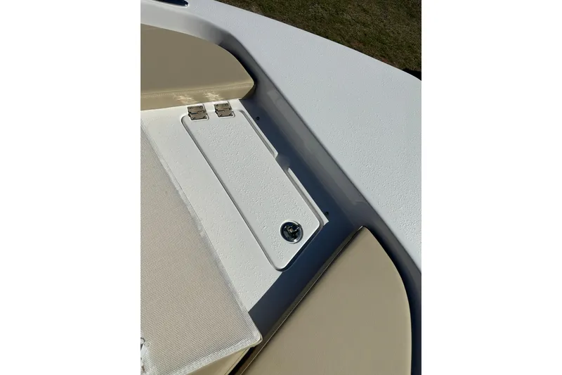 Slide: The Image of 2026 Action Craft 22 Bay boat deck with storage compartment and beige seating. - 35