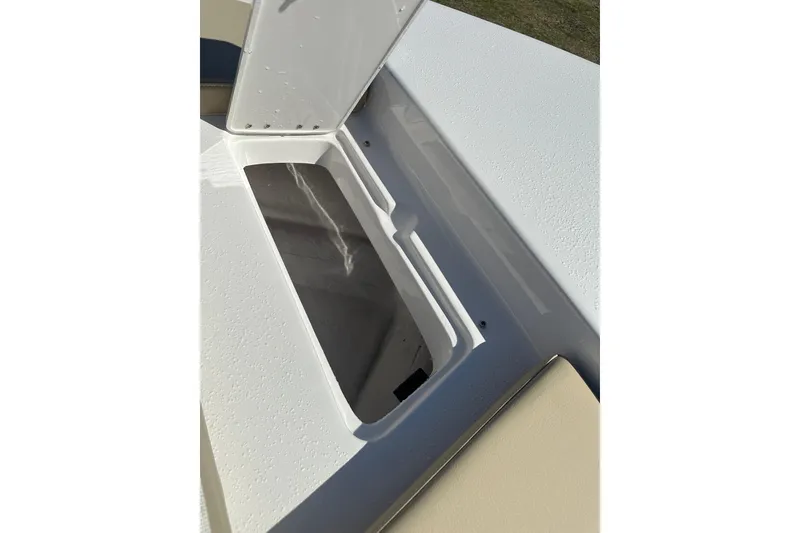 Slide: The Image of Open storage compartment on 2026 Action Craft 22 Bay boat deck. - 36
