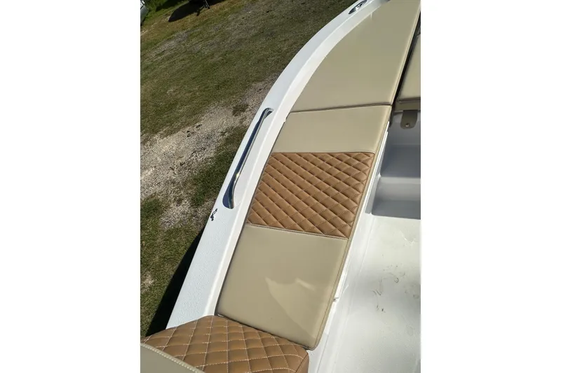 Slide: The Image of 2026 Action Craft 22 Bay boat with tan quilted seating detail. - 37