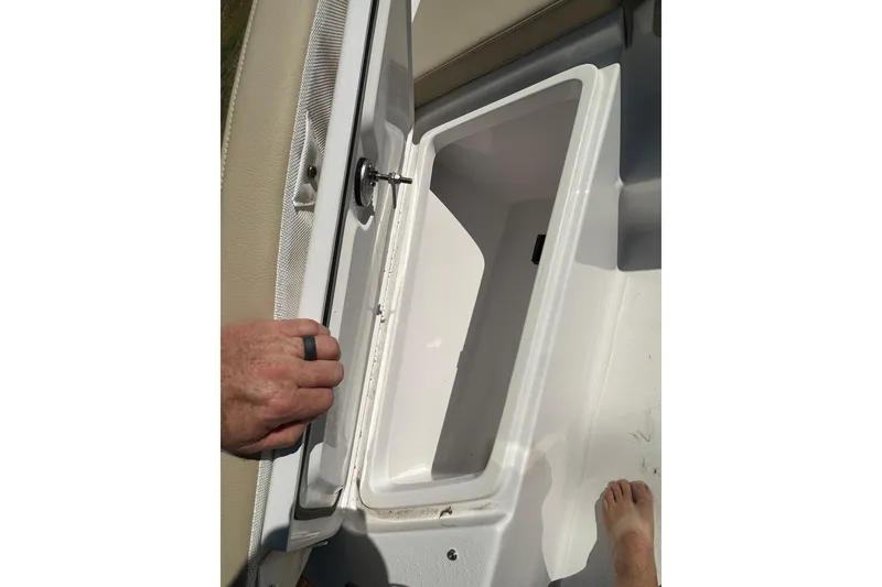 Slide: The Image of Open storage compartment on 2026 Action Craft 22 Bay boat, showing interior space. - 38