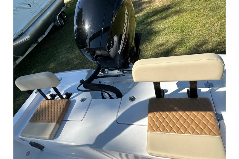 Slide: The Image of 2026 Action Craft 22 Bay boat with Mercury engine and cushioned seating. - 41