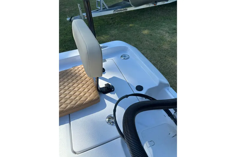 Slide: The Image of 2026 Action Craft 22 Bay boat interior with cushioned seating and deck details. - 44