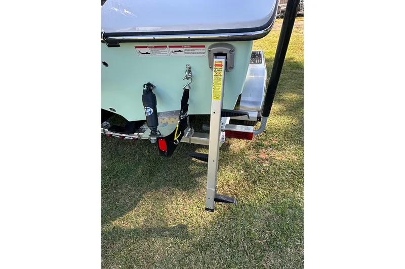 Slide: The Image of 2026 Action Craft 22 Bay boat trailer ladder on grass. - 6