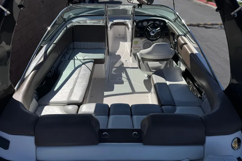 Slide: The Image of 2010 Regal 2300 RX Bowrider interior with spacious seating and modern dashboard. - 12