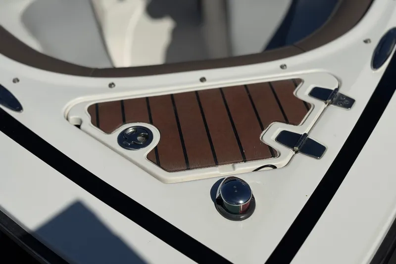 Slide: The Image of Close-up of 2010 Regal 2300 RX Bowrider's bow with wood accents and stainless steel fittings. - 13