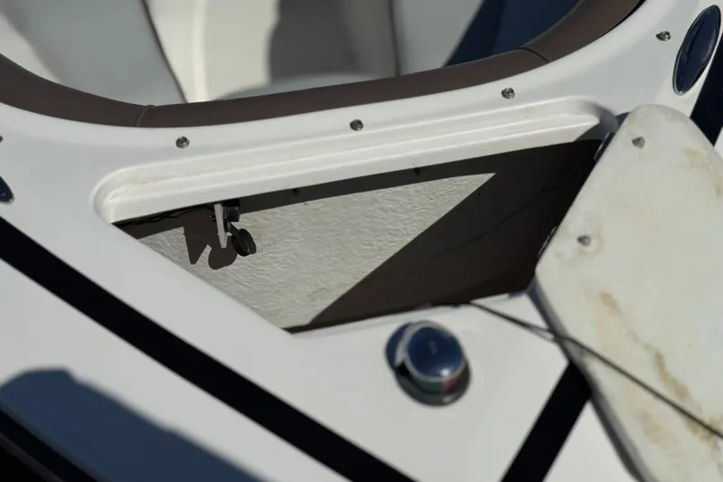 Slide: The Image of 2010 Regal 2300 RX Bowrider boat compartment detail with open hatch. - 14