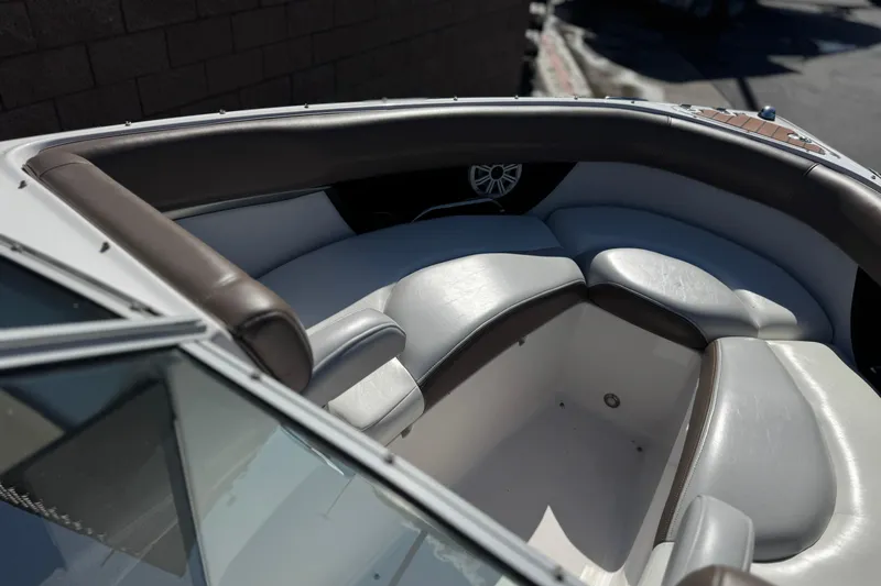 Slide: The Image of 2010 Regal 2300 RX Bowrider interior with cushioned seating and speaker detail. - 17