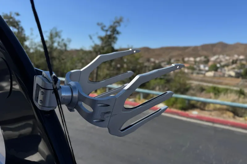 Slide: The Image of Wakeboard rack on a 2010 Regal 2300 RX Bowrider, with scenic background. - 21