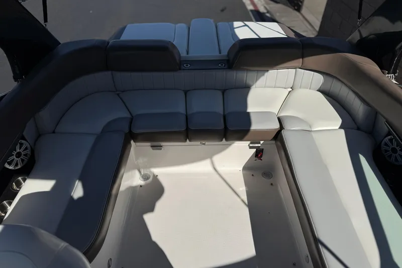 Slide: The Image of 2010 Regal 2300 RX Bowrider interior seating, featuring spacious, cushioned layout. - 23