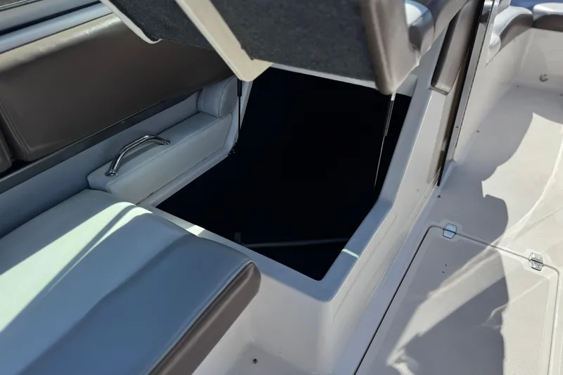 Slide: The Image of 2010 Regal 2300 RX Bowrider interior storage compartment with cushioned seating. - 30