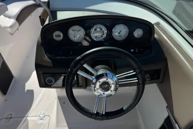 Slide: The Image of Steering wheel and dashboard of 2010 Regal 2300 RX Bowrider boat. - 32