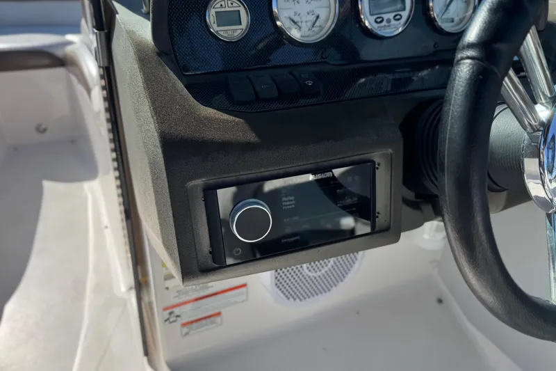 Slide: The Image of Dashboard of a 2010 Regal 2300 RX Bowrider with steering wheel and controls. - 33