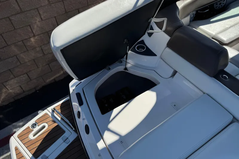 Slide: The Image of 2010 Regal 2300 RX Bowrider boat interior with open storage compartment. - 7