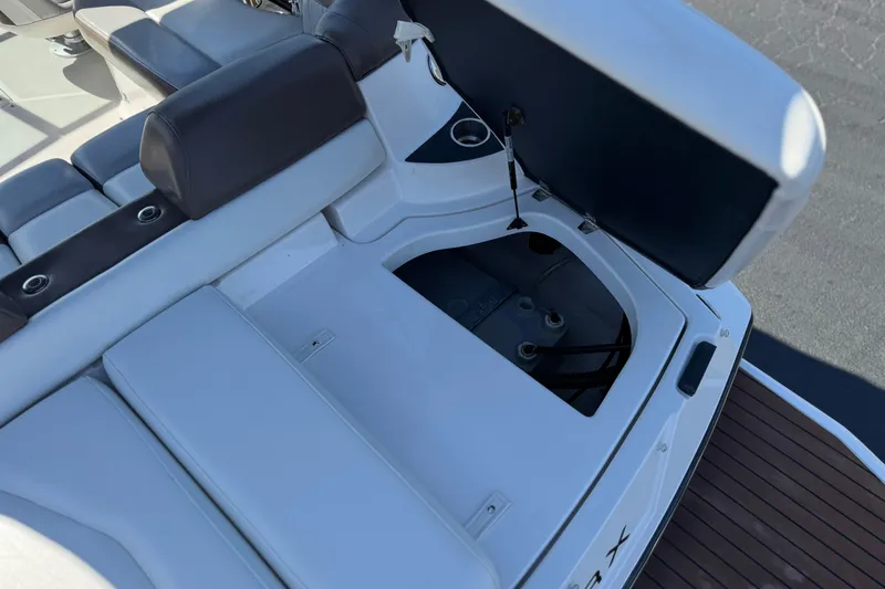 Slide: The Image of 2010 Regal 2300 RX Bowrider boat interior with open storage compartment. - 8