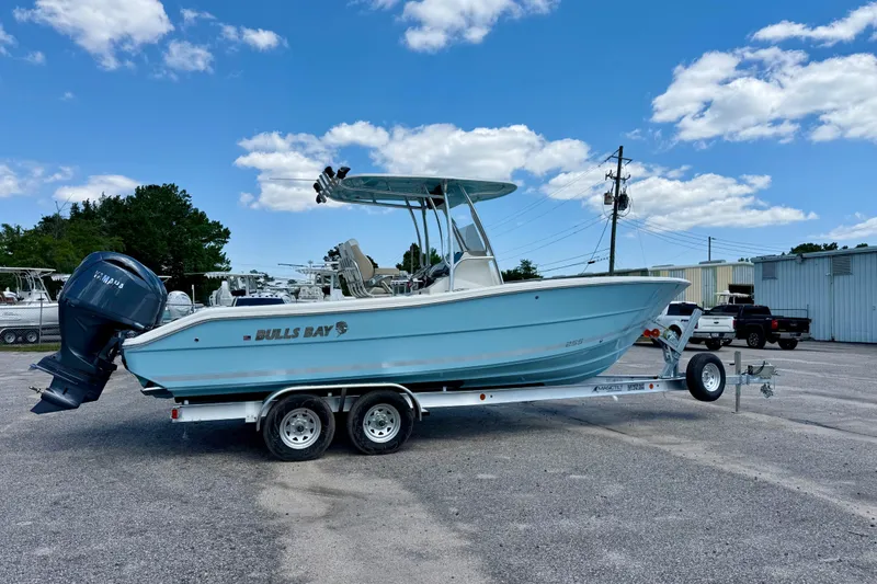 Slide: The Image of 2026 Bulls Bay 255 Center Console boat on trailer under blue sky. - 5