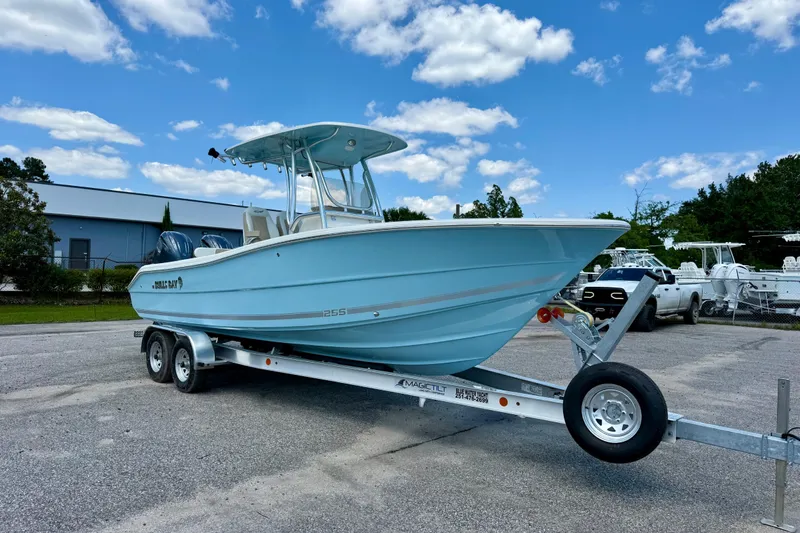 Slide: The Image of 2026 Bulls Bay 255 Center Console boat on trailer under blue sky. - 6