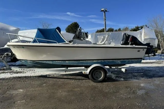 The Image of 1991 Mako 191 Inshore boat on trailer, parked outdoors in winter setting. - 0