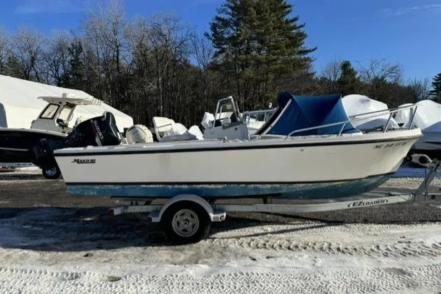 Slide: The Image of 1991 Mako 191 Inshore boat on trailer, parked outdoors in a snowy area. - 3