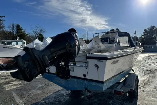 Slide: The Image of 1991 Mako 191 Inshore boat on trailer, outboard motor, sunny day. - 4