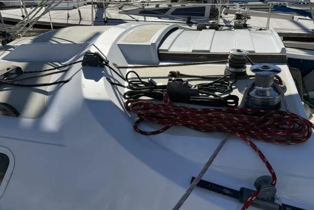 Slide: The Image of Deck of 1976 CAL 3-30 sailboat with ropes and winches. - 10