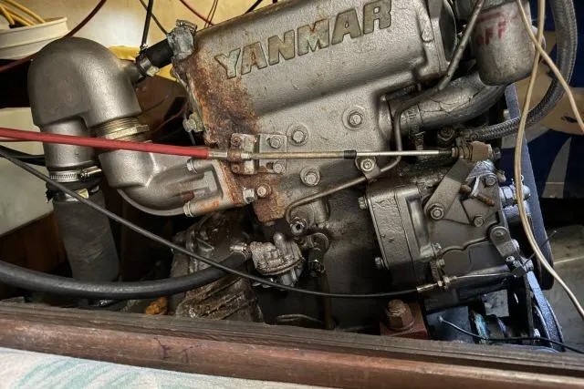 Slide: The Image of 1976 CAL 3-30 boat engine, Yanmar diesel, detailed view with visible components. - 16