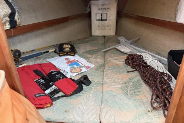 Slide: The Image of Cozy cabin interior of 1976 CAL 3-30 sailboat with nautical gear and accessories. - 3