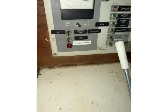 Slide: The Image of Control panel of a 1976 CAL 3-30 boat with various switches and indicators. - 6