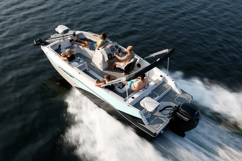 Slide: The Image of Manufacturer Provided Image: 2026 Starcraft SVX 211 OB boat cruising on water with passengers enjoying the ride. - 12