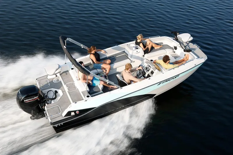Slide: The Image of Manufacturer Provided Image: 2026 Starcraft SVX 211 OB boat cruising with passengers on a sunny day. - 13