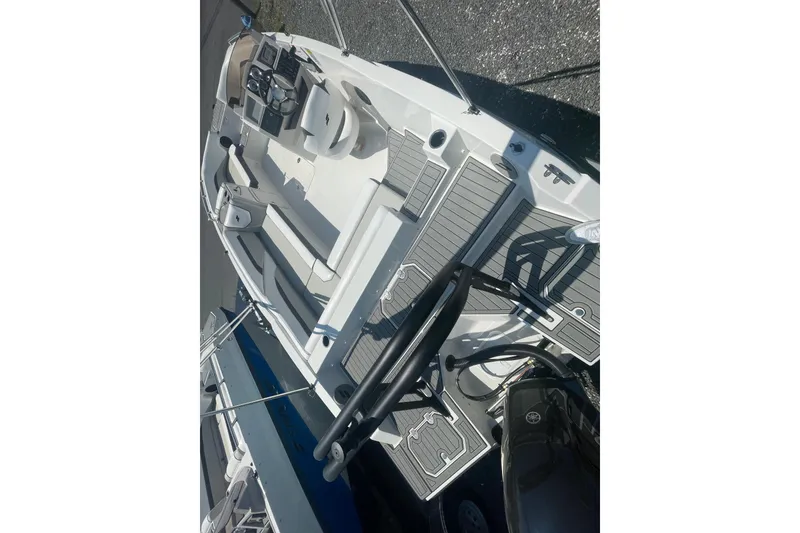 Slide: The Image of 2026 Starcraft SVX 211 OB boat interior with seating and steering wheel. - 19