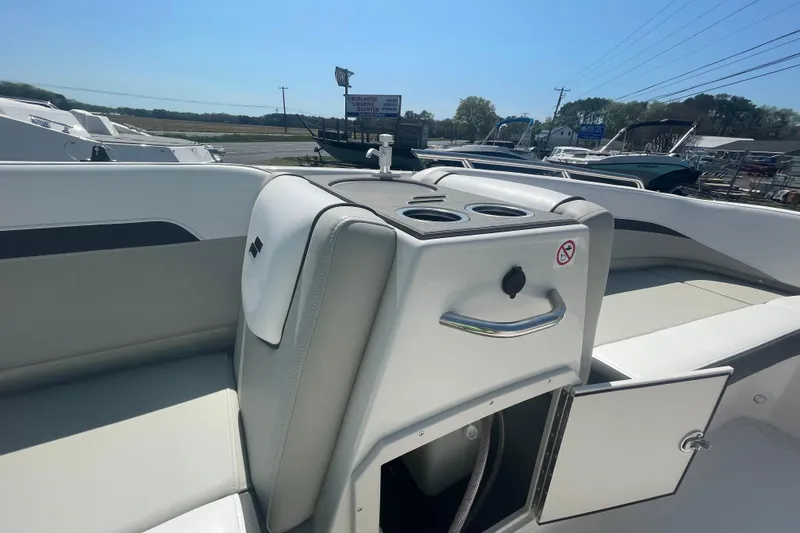 Slide: The Image of 2026 Starcraft SVX 211 OB boat interior with seating and storage compartments. - 2