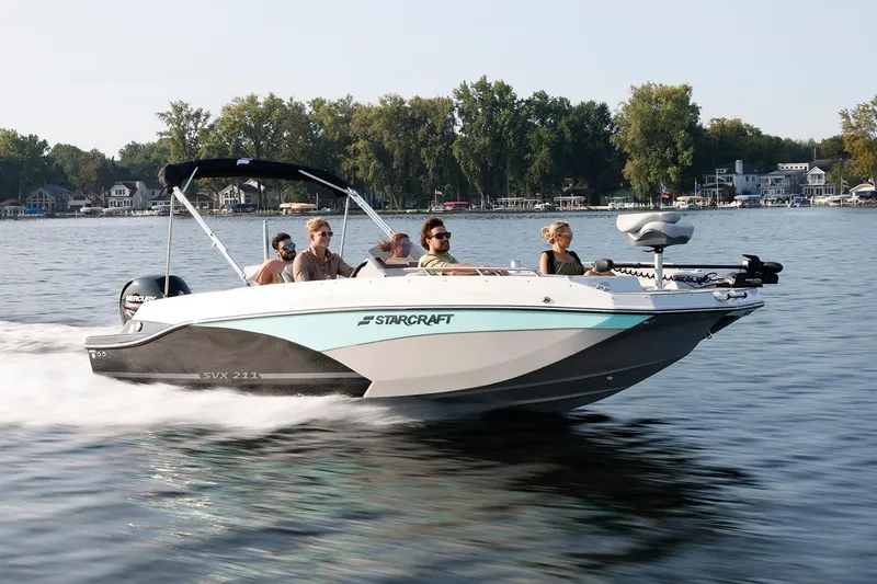 Slide: The Image of Manufacturer Provided Image: 2026 Starcraft SVX 211 OB boat cruising on a lake with passengers onboard. - 6