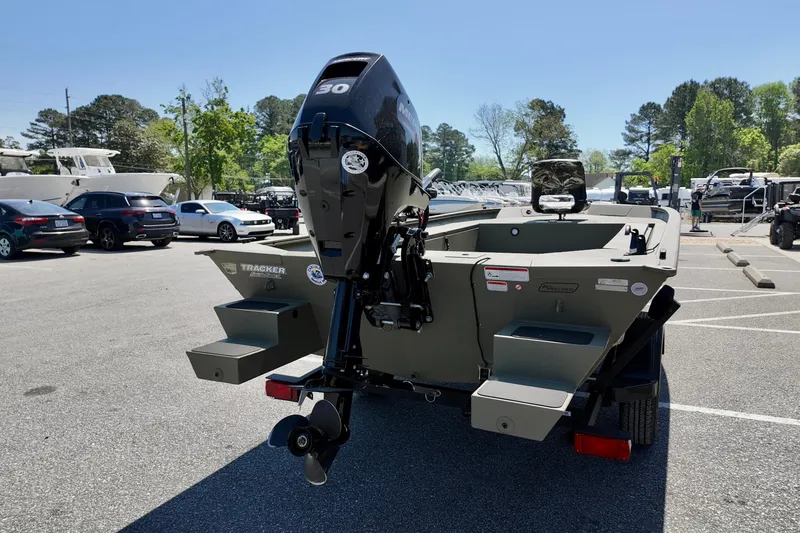 Slide: The Image of 2025 TRACKER BOATS 1654 MVX Sportsman in parking lot, rear view with motor. - 5