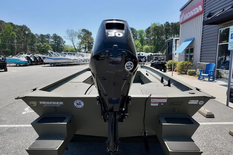 Slide: The Image of 2025 TRACKER BOATS 1654 MVX Sportsman with 30 HP motor at dealership. - 6