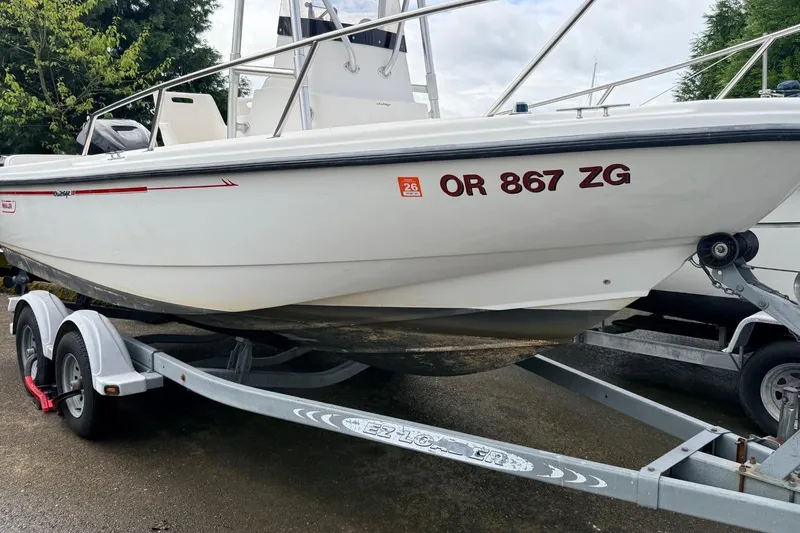 Slide: The Image of 1999 Boston Whaler Outrage 18 boat on trailer, registration OR 867 ZG. - 4
