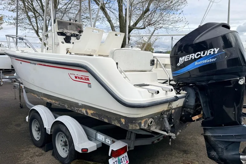 Slide: The Image of 1999 Boston Whaler Outrage 18 boat with Mercury Saltwater engine on trailer. - 9