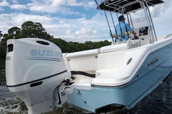 Slide: The Image of Manufacturer Provided Image: 2025 Bulls Bay 230 Center Console boat with Suzuki engine on water. - 2