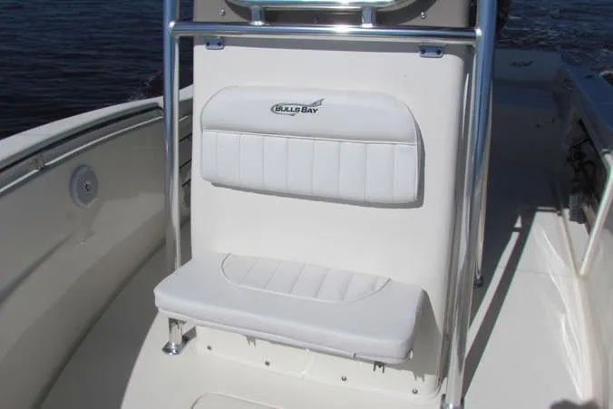 Slide: The Image of Manufacturer Provided Image: 2025 Bulls Bay 230 Center Console boat with white seating and stainless steel frame. - 4