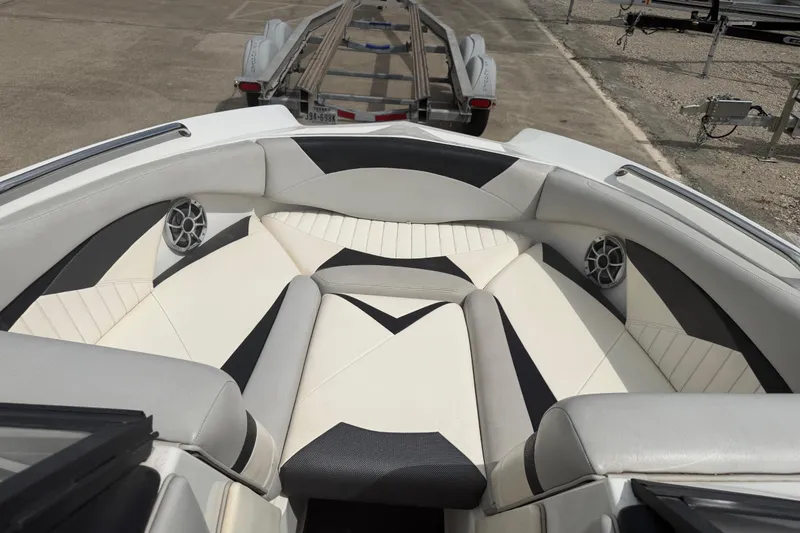 Slide: The Image of 2010 Tigé RZ2 boat interior with stylish seating and speakers. - 14