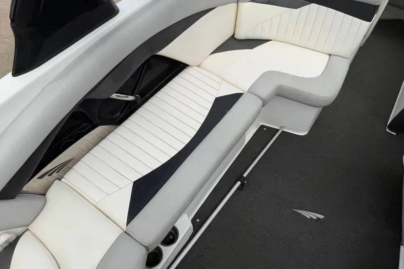 Slide: The Image of 2010 Tigé RZ2 boat interior with stylish white and gray seating. - 22