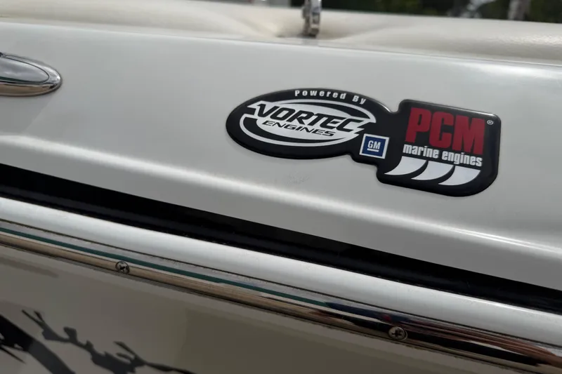 Slide: The Image of 2010 Tigé RZ2 boat featuring Vortec and PCM marine engine logos. - 26