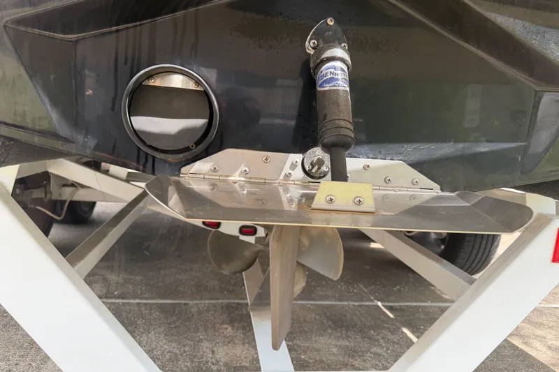 Slide: The Image of 2010 Tigé RZ2 boat stern with propeller and trim tab detail. - 27