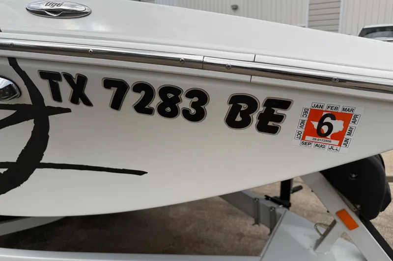 Slide: The Image of 2010 Tigé RZ2 boat with registration TX 7283 BE and inspection sticker. - 29