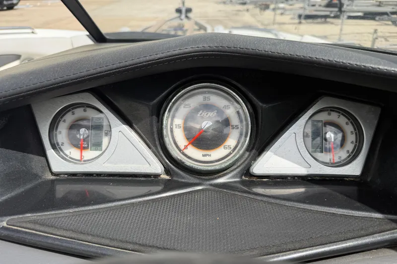 Slide: The Image of Dashboard of a 2010 Tigé RZ2 boat showing speedometer and gauges. - 32