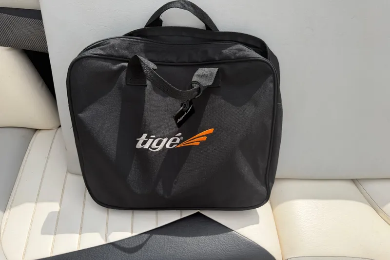 Slide: The Image of Black Tigé bag on white boat seat, 2010 Tigé RZ2 model. - 33