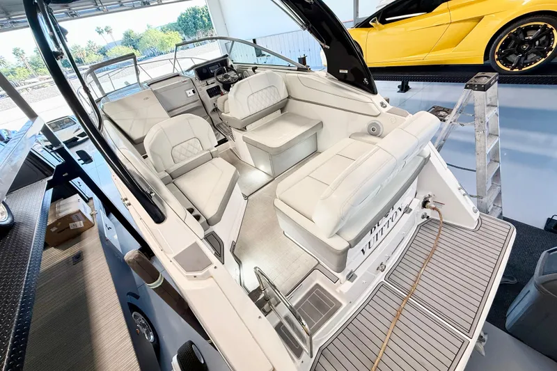 Slide: The Image of 2021 Regal 26 Express boat interior with luxurious seating and modern dashboard. - 11