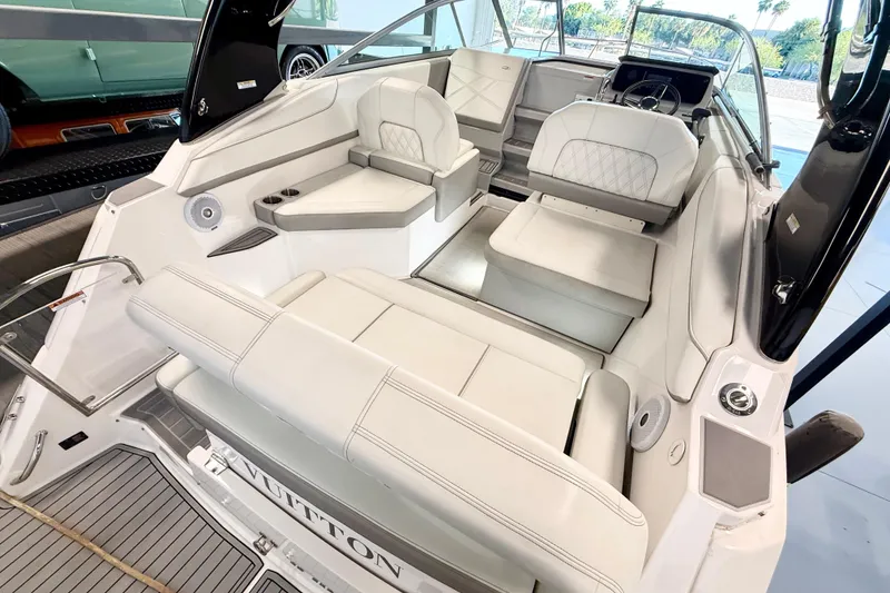 Slide: The Image of 2021 Regal 26 Express boat interior with white seating and modern design. - 12