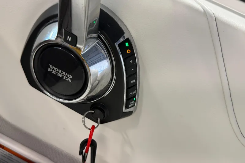 Slide: The Image of Volvo Penta throttle control on 2021 Regal 26 Express boat dashboard. - 15