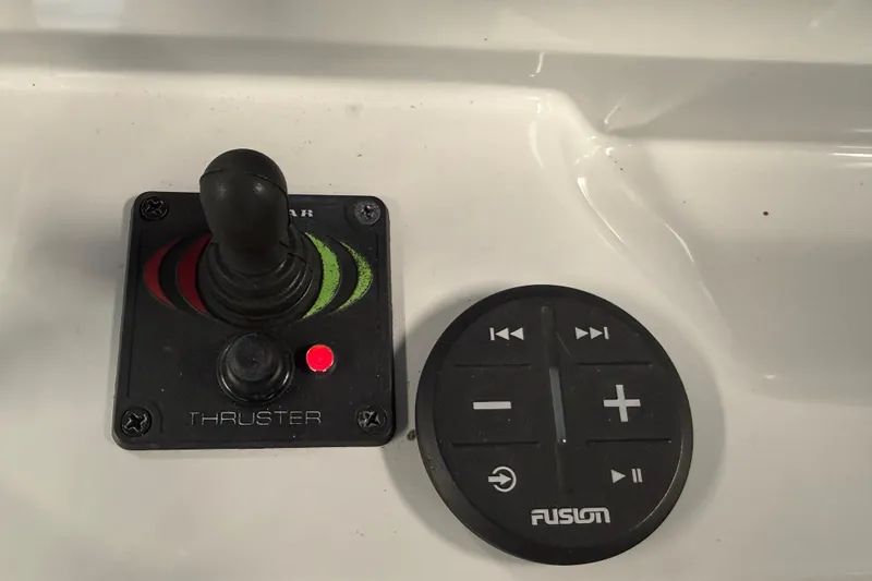Slide: The Image of Joystick and control panel on 2021 Regal 26 Express boat dashboard. - 32