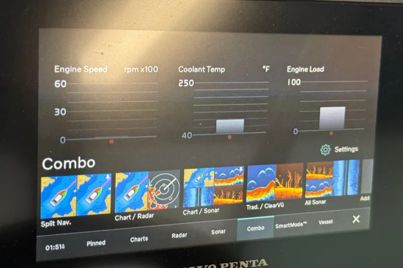 Slide: The Image of Dashboard display of a 2021 Regal 26 Express boat showing engine metrics and navigation options. - 37
